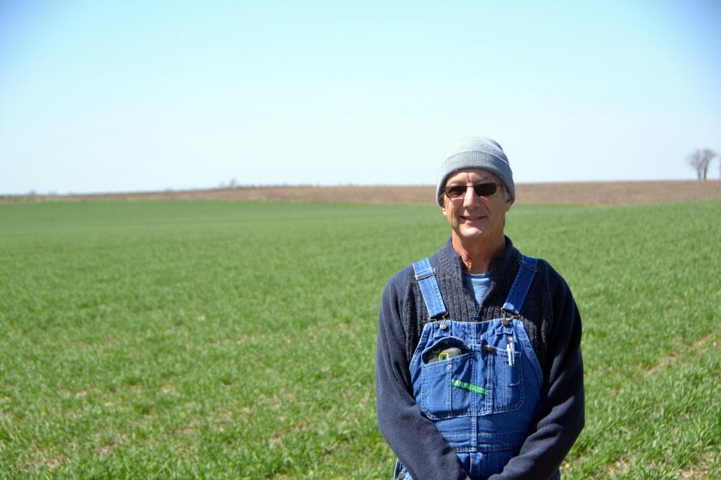 Dick sloan in front of wheat