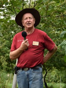 Tom Wahl by chestnut tree speaking at 2018 field day
