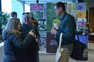 attendees networking between sessions at practical farmers of iowa annual conference 2019