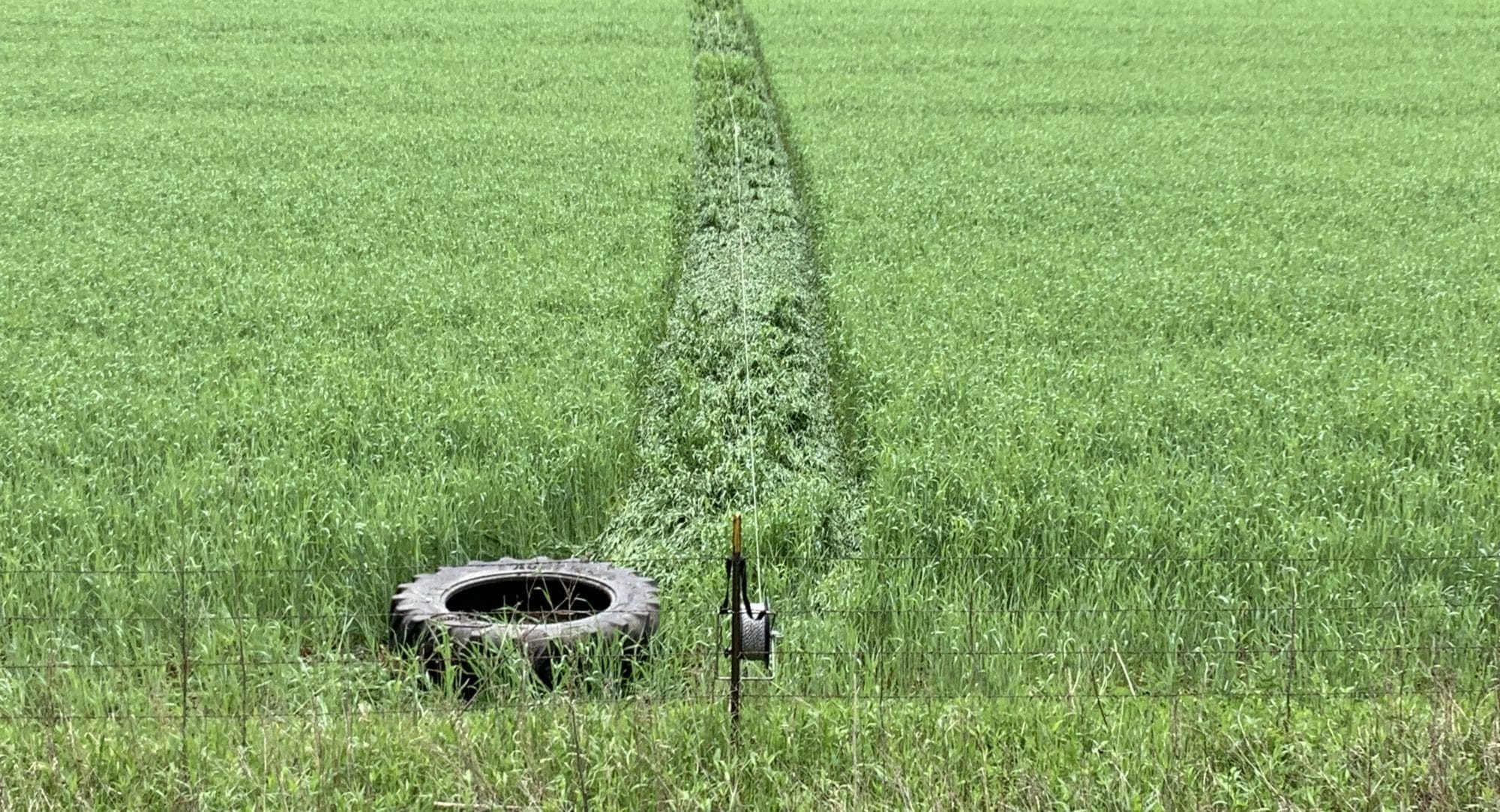Tire drag through field for electric fencing path RickMatt