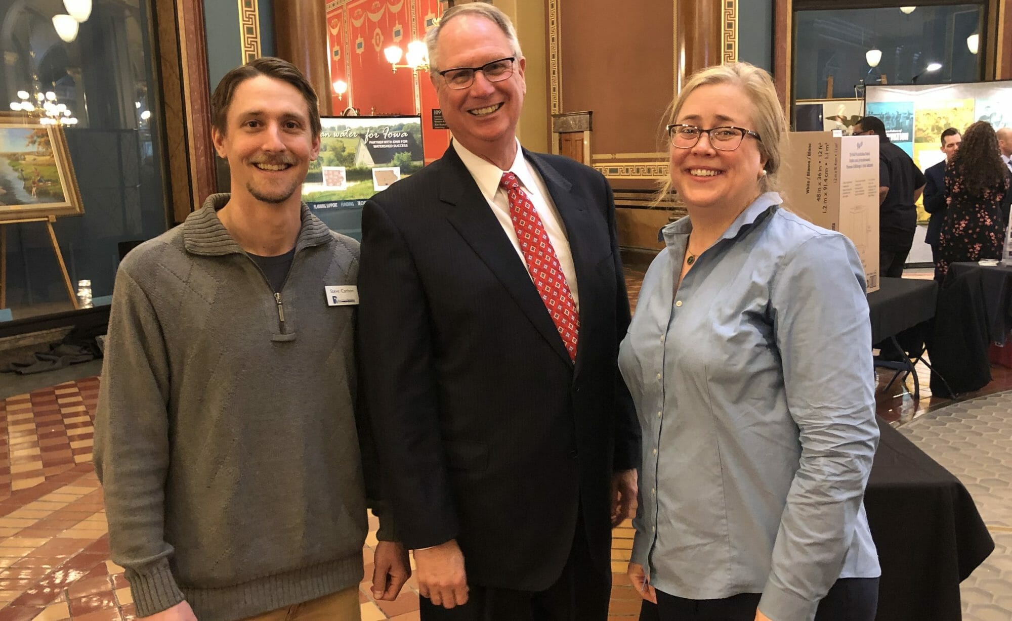 Steve Carlson and April Burch soil and water conservation district commissioners meeting with Iowa state representative Rob Bacon