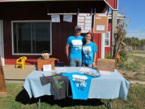 Ethan and Rebecca Book by farm table and barn