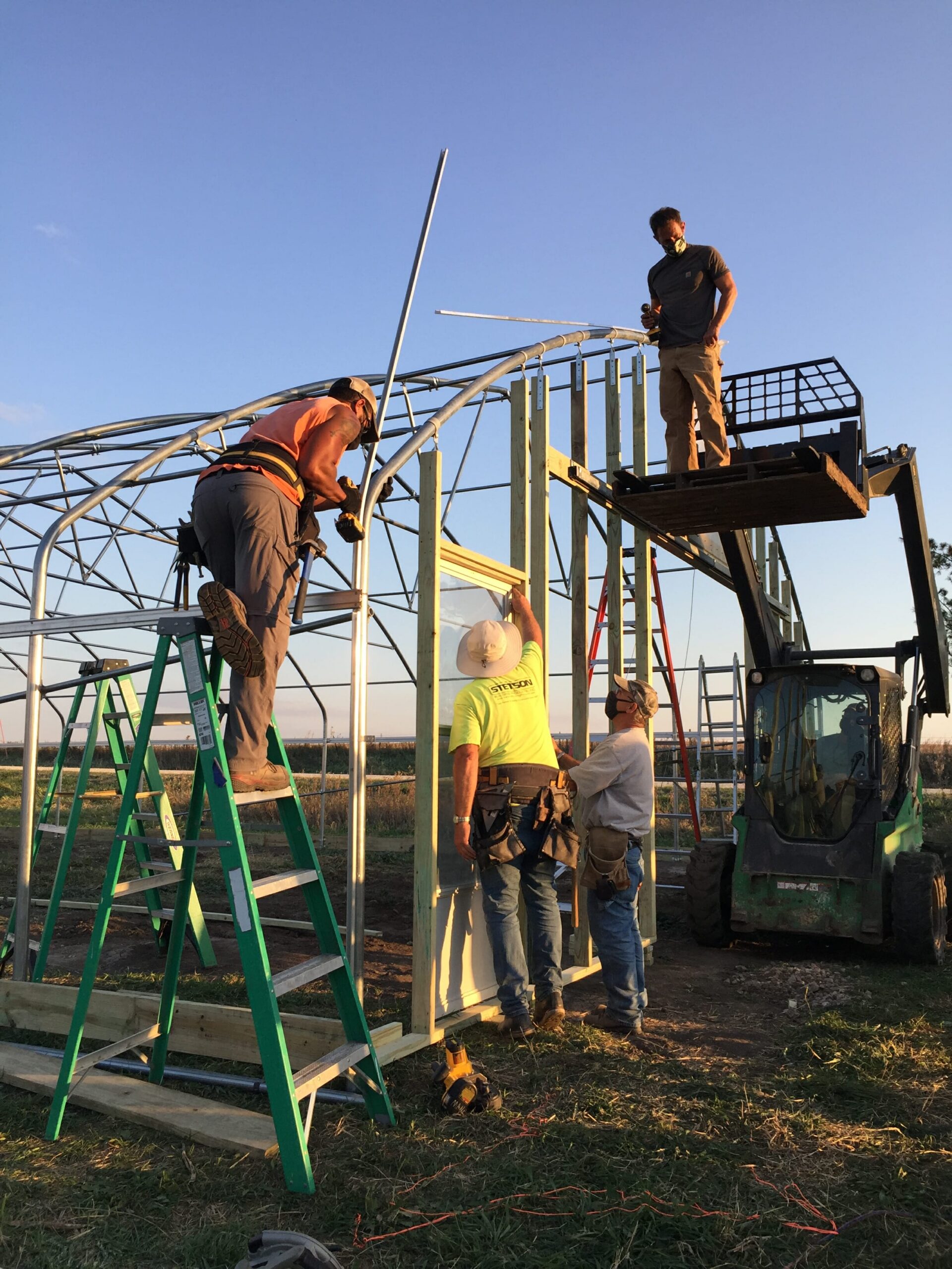 Working in golden light at October 2020 high tunnel build