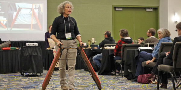 Attendees watch presenter demo at Annual Conference Session