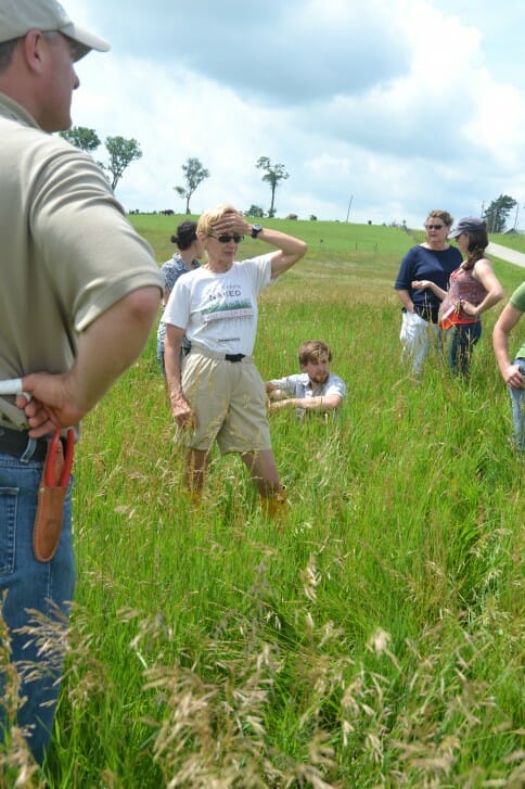 Attendees at David Carbaugh's field day discuss pasture mixes, cattle breeds, and fencing strategies.