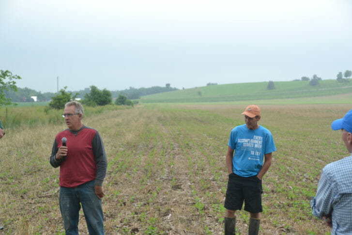 Steve Berger (left) and George Schaefer discuss the importance of proper management to make cover crops successful in a cropping system.