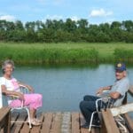 Marilyn and Leon Isakson at the pond they built on their farm