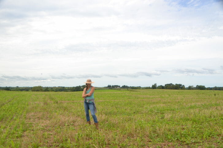 PFI member Hannah Bernhardt checks out Paul's diverse cover crop mix. Paul will graze cattle here after a fall frost. He expects to have enough forage per acre for one cow for 30 days.