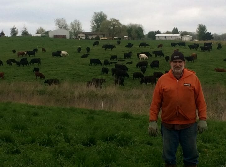 Bruce Carney with his herd of grass-fed cattle.
