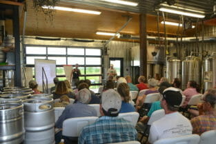 The first portion of the field day was held in the back of Alluvial Brewery, and the large crowd had some of us peering around kegs and fermentation vessels.