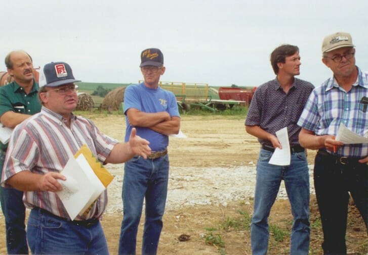 Vic Madsen (speaking) presents about on-farm research at a field day in the early 1990s.