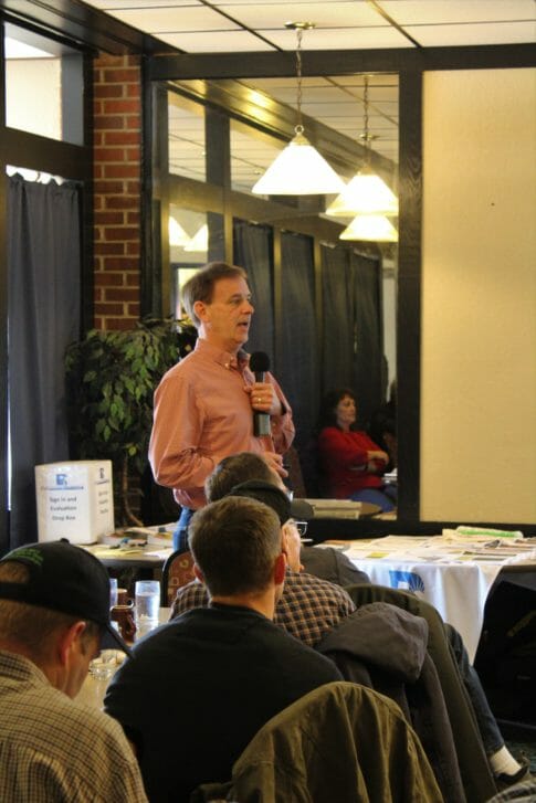 Clark Thompson speaking to a crowd at the Royal Cafe in Story City